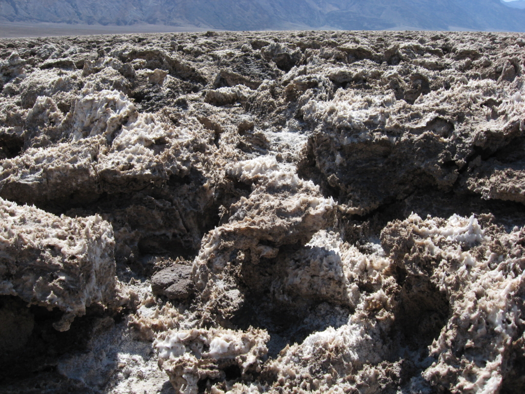 Small, jagged rocks covered with salt crystals